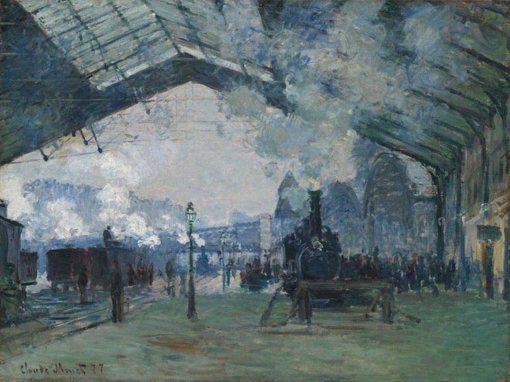 Una locomotora llega entre nubes de vapor bajo el techo de hierro y vidrio de la estación Saint-Lazare, pintada por Claude Monet.